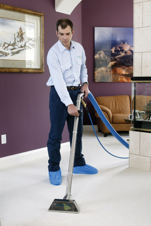 ServiceMaster at Fresno technician cleaning carpet